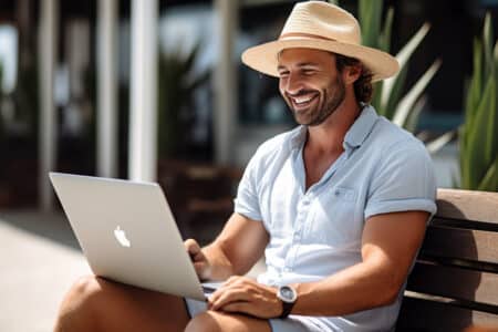 all images man wearing hat using laptop